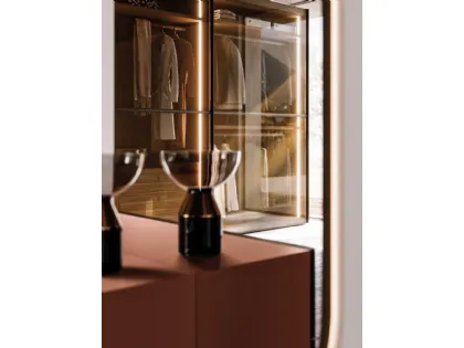Sliding wardrobe with Frame door. Interior in terracotta, Frame doors in bronzed glass and burnished metal.
