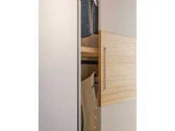Sliding wardrobe with Maya door. Interior in Oak, doors in sand-colored matte lacquer and textured Oak.