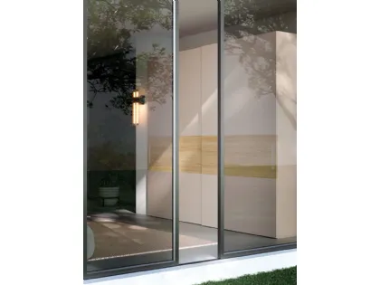 Sliding wardrobe with Maya door. Interior in Oak, doors in matte Sand lacquer and textured Oak.