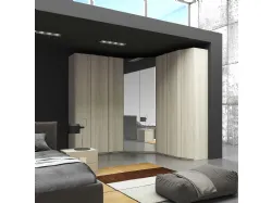 Corner wardrobe with hinged door, with mirror in the corner module.