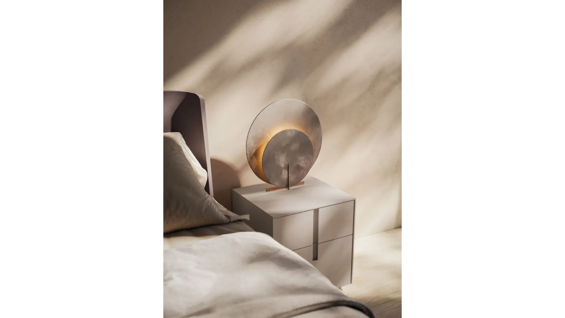 Double bedroom with Aura bed frame in matte lacquer and base in burnished metal.