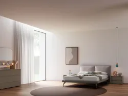 Modern double bedroom with upholstered fabric bed and night group in matte lacquered Earth.