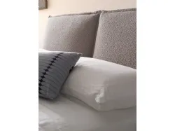 Modern double bedroom with upholstered fabric bed and night group in matt lacquered Earth.