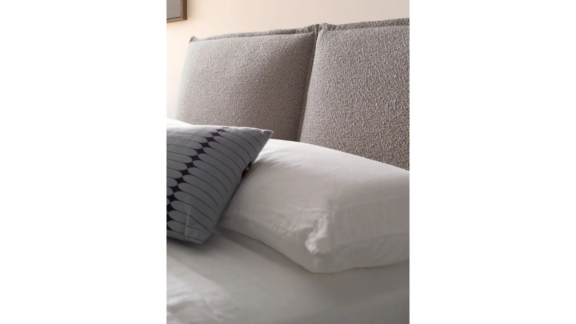 Modern double bedroom with upholstered fabric bed and night group in matt lacquered Earth.