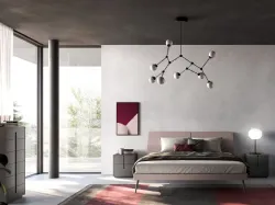 Modern double room with a designer bed and customizable night group in the finishes.