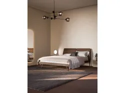Double room complete with Ofelia bed with textured bed frame and burnished metal legs.