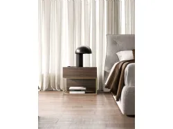Double bedroom with fabric bed frame and textured Cotto night group.
