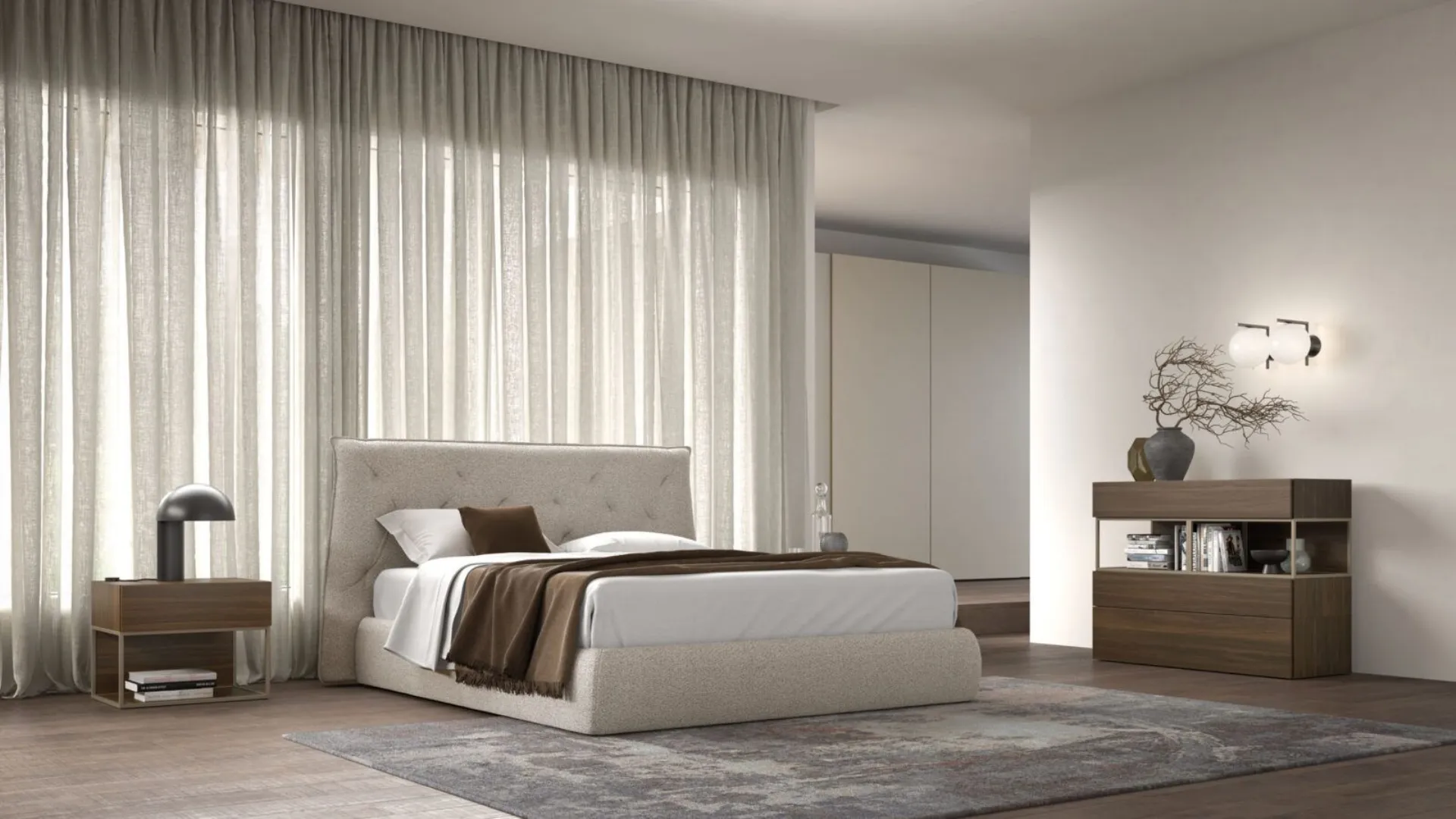 Double bedroom with bed frame with fabric bedskirt and night group in textured terracotta.