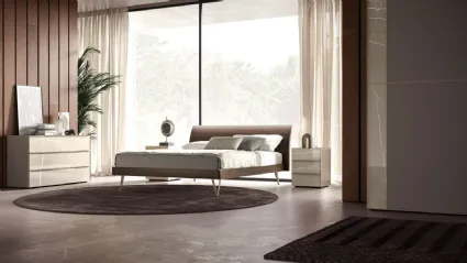 Double bedroom with Loge bed model, with textured bed frame and Palladio metal feet.