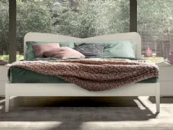 Double bed with shaped headboard, quality materials, and customizable finishes 160x195