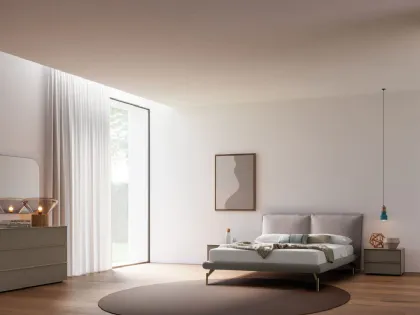 Double bed model Alissa with padded bedframe and Palladio lacquered metal foot.