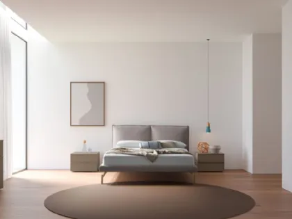 Double bed model Alissa with upholstered bed frame and Palladium lacquered metal foot.