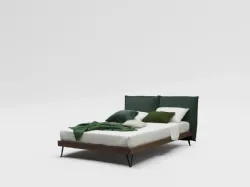 Double bed model Alissa upholstered in fabric with textured bed frame and metal feet.