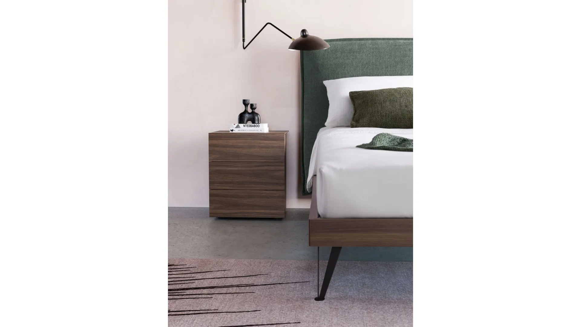 Double bed model Alissa upholstered in fabric with textured bed frame and metal feet.