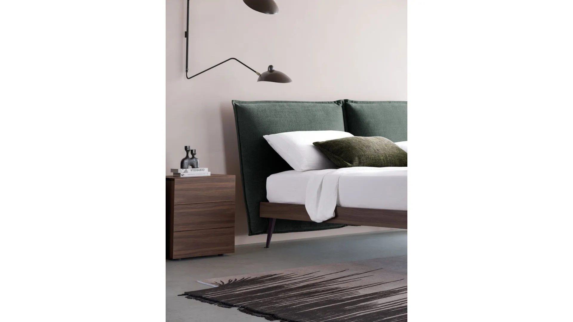Matrimonial bed model Alissa upholstered in fabric with textured bed frame and metal feet.