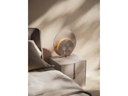 Double bed model aura with bed frame in matte lacquered Clay and feet in burnished metal.