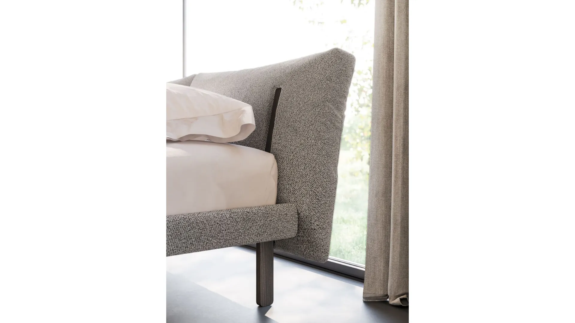 Double bed model Brigitta with padded bed frame and Carbon textured footboard.