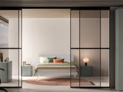 Double bed model Larissa with structure in matt lacquer and feet in plexiglass.