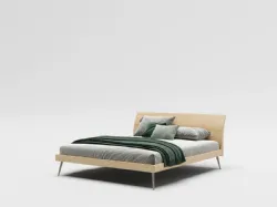 Double bed model Loge with textured bedframe and Palladio lacquered metal foot.