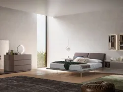 Double bed model Ofelia with reclining upholstered headboard in fabric.