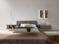 Queen-size bed model Ofelia with a reclining upholstered headboard in fabric.