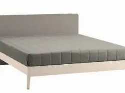 Double bed with rounded headboard, quality materials and customizable finishes.
