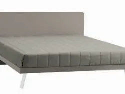Double bed with rounded headboard, quality materials, and customizable finishes.