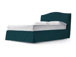 King-size romantic matrimonial bed with a canopy covered by a soft bed skirt