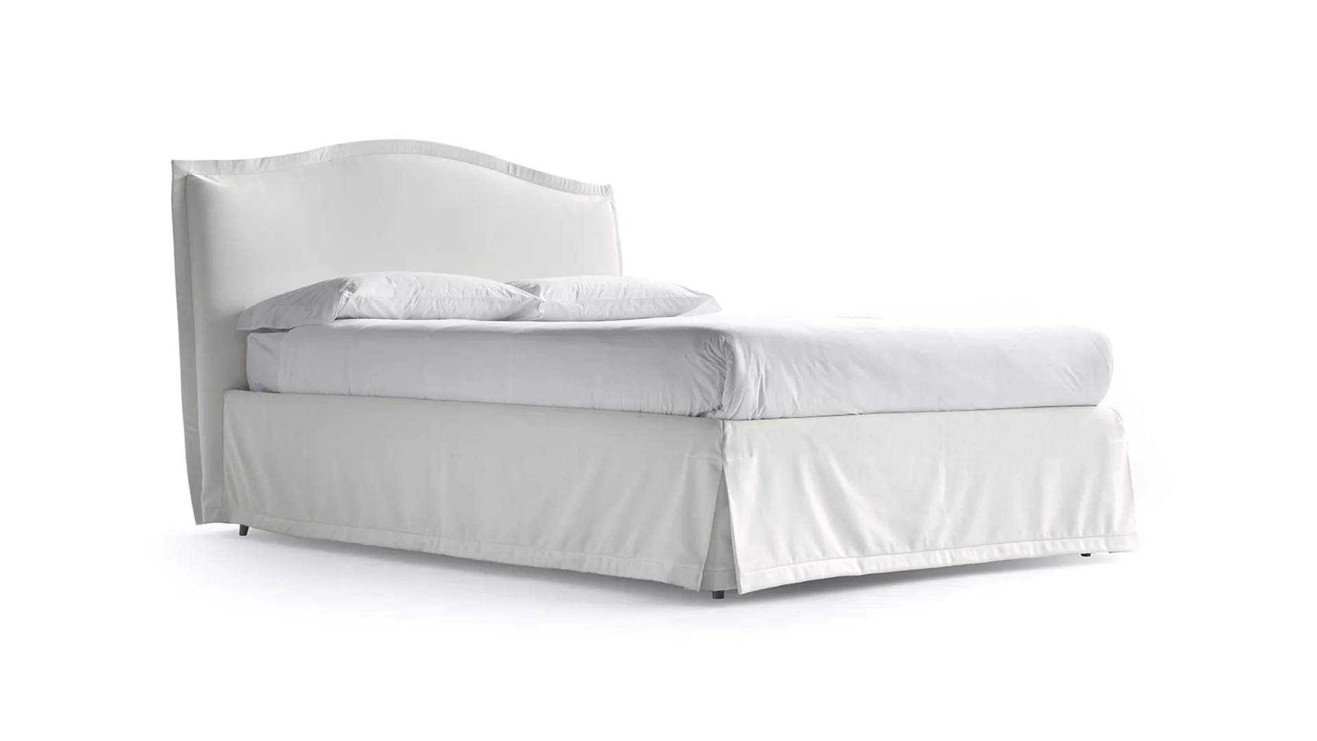 Nightly, double romantic canopy bed with bedskirt covered with a soft valance.