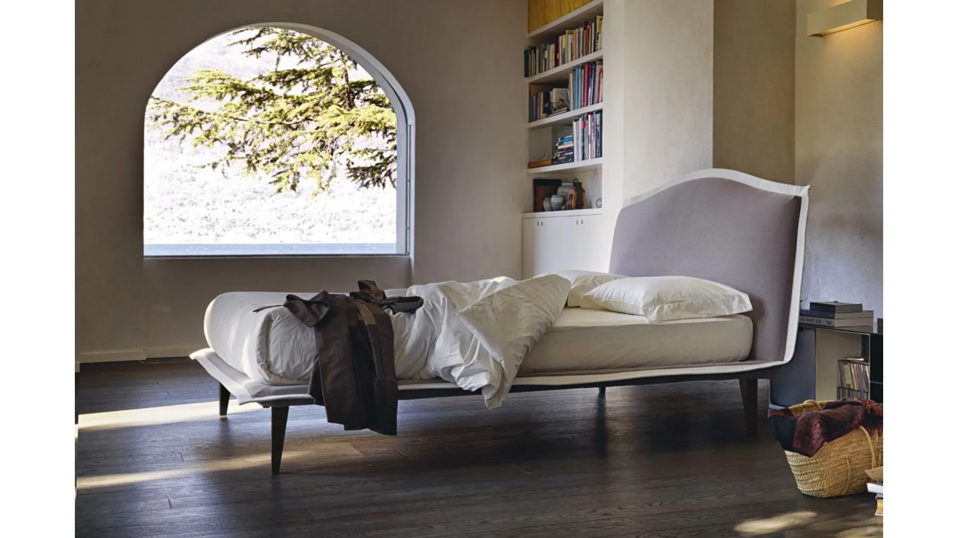 Noctis Lyle Voulant double bed with slightly tilted headboard and wooden legs.