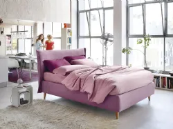 Double bed Noctis Osaka with a padded, curved and enveloping headboard.