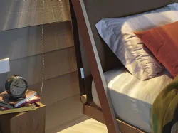 King-size bed with high headboard in fabric.