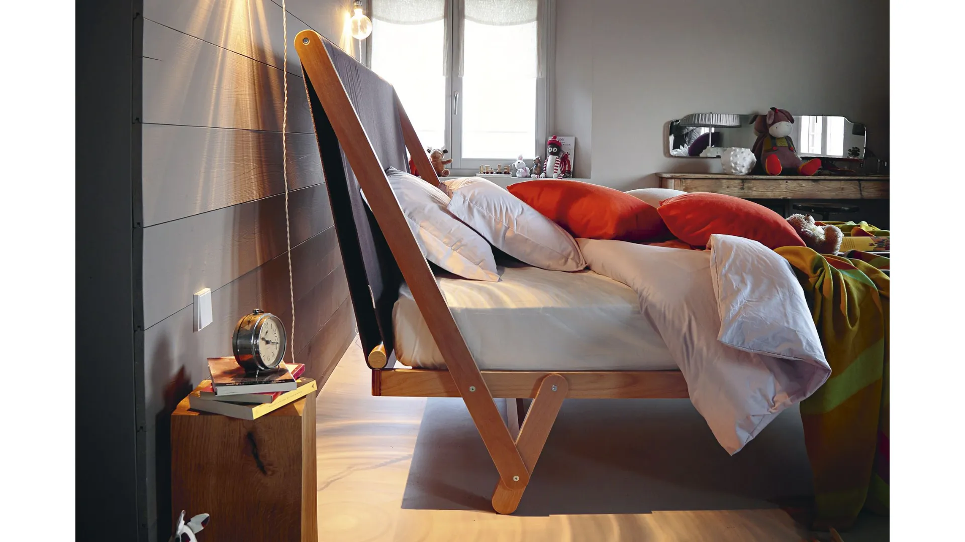 High double bed with high fabric headboard.
