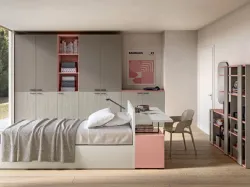 Modern teenager room with a desk that acts as a headboard to optimize space.