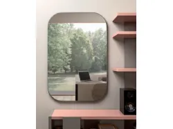 Modern bedroom for teenagers with a desk that doubles as a headboard to optimize space.