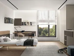 Modern design bedroom with desk and peninsula unit ideal for integrating TV.