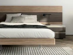 Modern designed bedroom with desk and peninsula furniture, ideal for integrating a TV.
