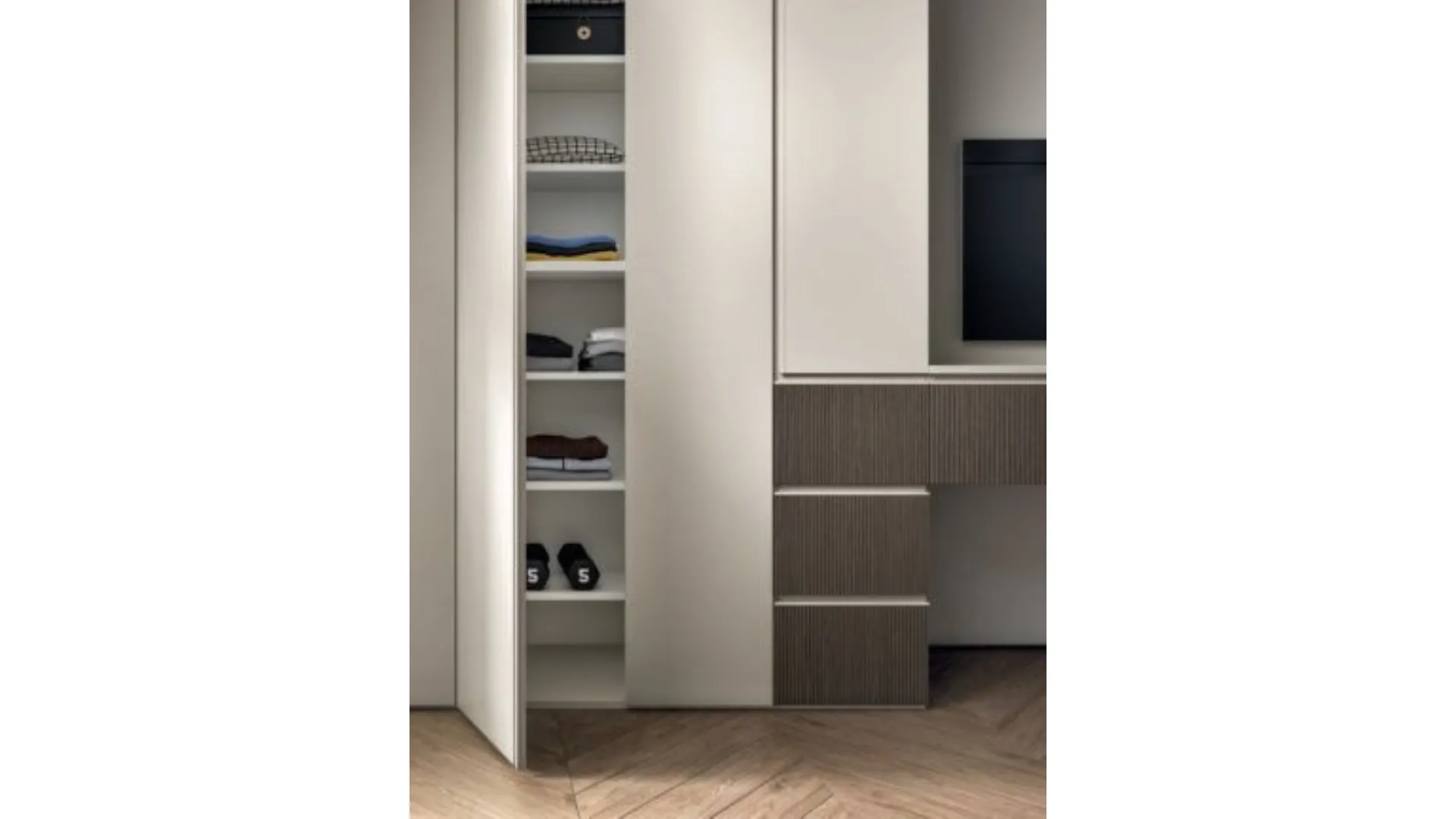 Modern design bedroom with desk and peninsula unit ideal for integrating TV.