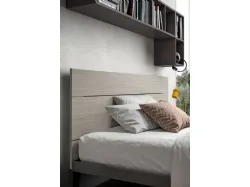 Modern bedroom for teenagers with integrated desk in the wardrobe.
