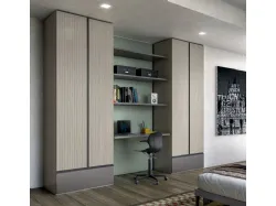 Modern teenage bedroom with integrated desk in the wardrobe.
