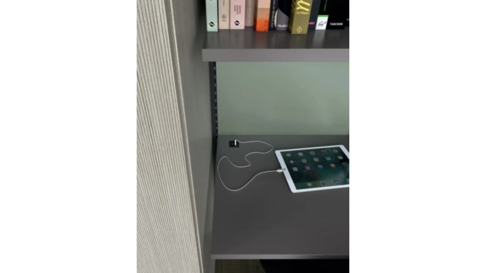 Modern bedroom for teenagers with integrated desk in the wardrobe.