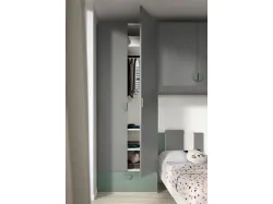 Modern children's bedroom with a bridge wardrobe and two-tone designer library.