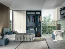 Refined and modern bedroom, complete with wardrobe and study area.