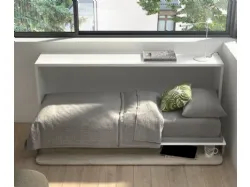 Single foldaway bed with integrated writing desk, customizable in finishes.