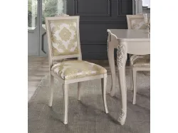 Classic living room composed of a two-door sideboard, extendable table, and elegant chairs.
