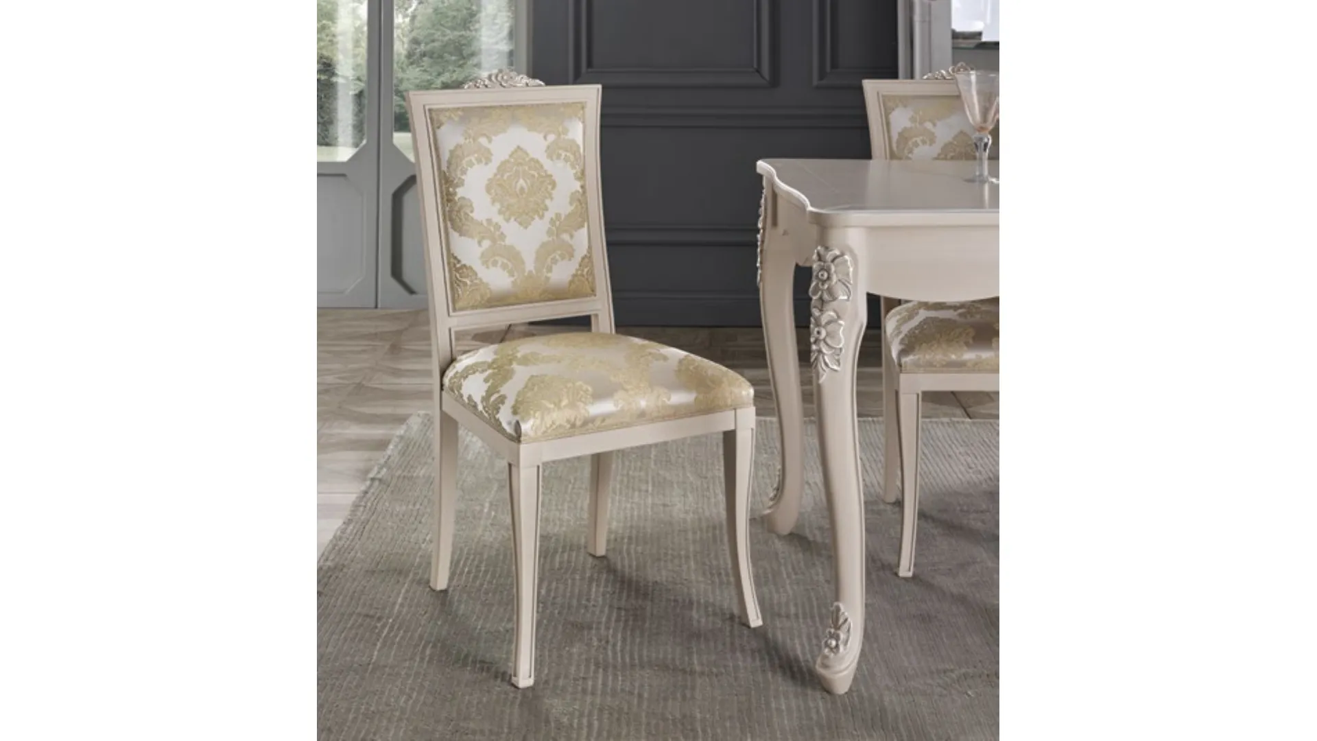 Classic living room composed of a two-door sideboard, extendable table, and elegant chairs.