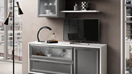 Living room complete with sideboard, wall cabinets and a TV area with shelves.