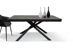 Extendable table of various measurements with side extension and central base.