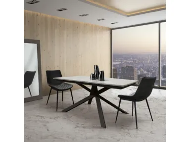 Extendable table with metal base and 50cm lateral extension.