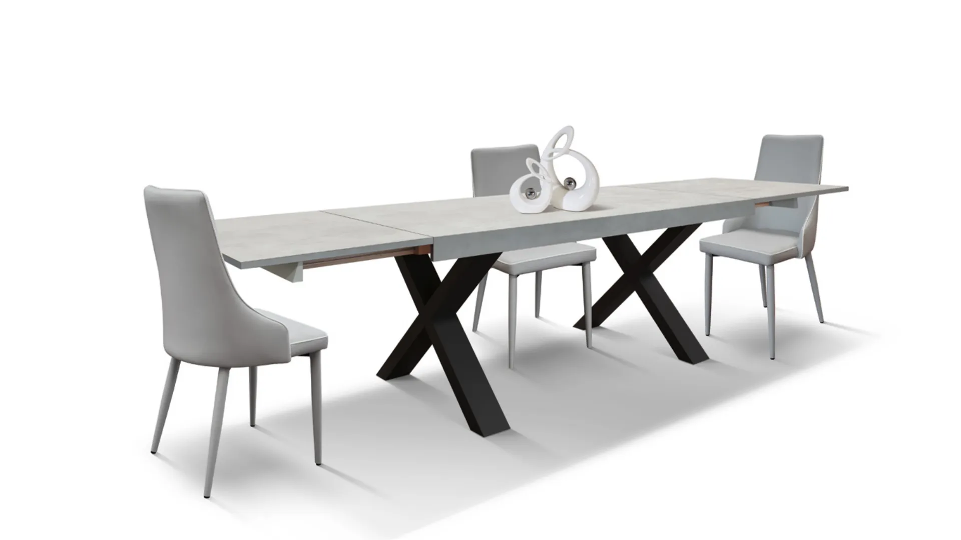 Extendable laminated table with X-shaped designer legs and two side extensions.